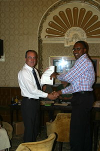 Steve Buchanan, Ray Davies and Glenn Roberts receive their Approved Tutor Certficates from Dr Stephen Ladyman MP